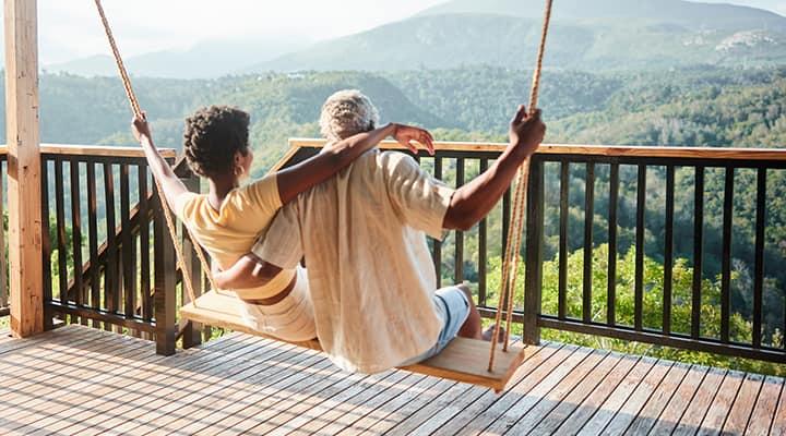 A couple enjoying a peaceful mountain view together